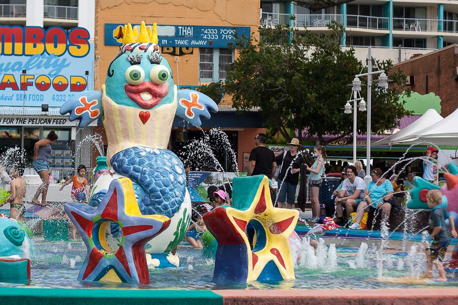 Children playing at the water fountain in The Entrance
